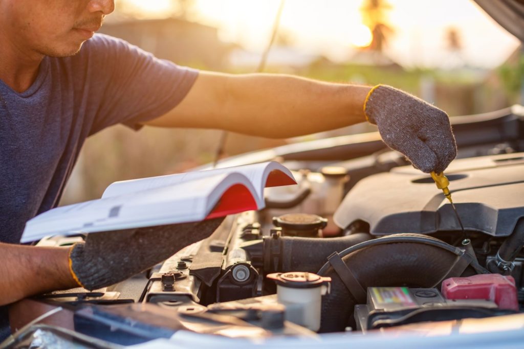 mechanic with repair manual