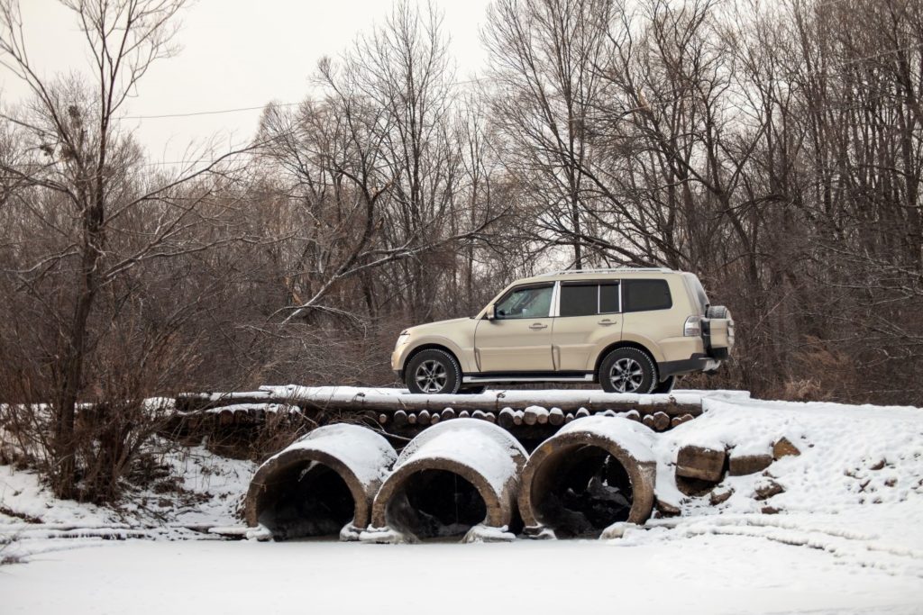 mitsubishi montero on a snowy trail