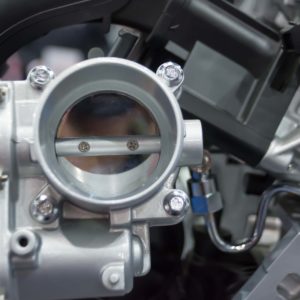 close up of throttle body and engine