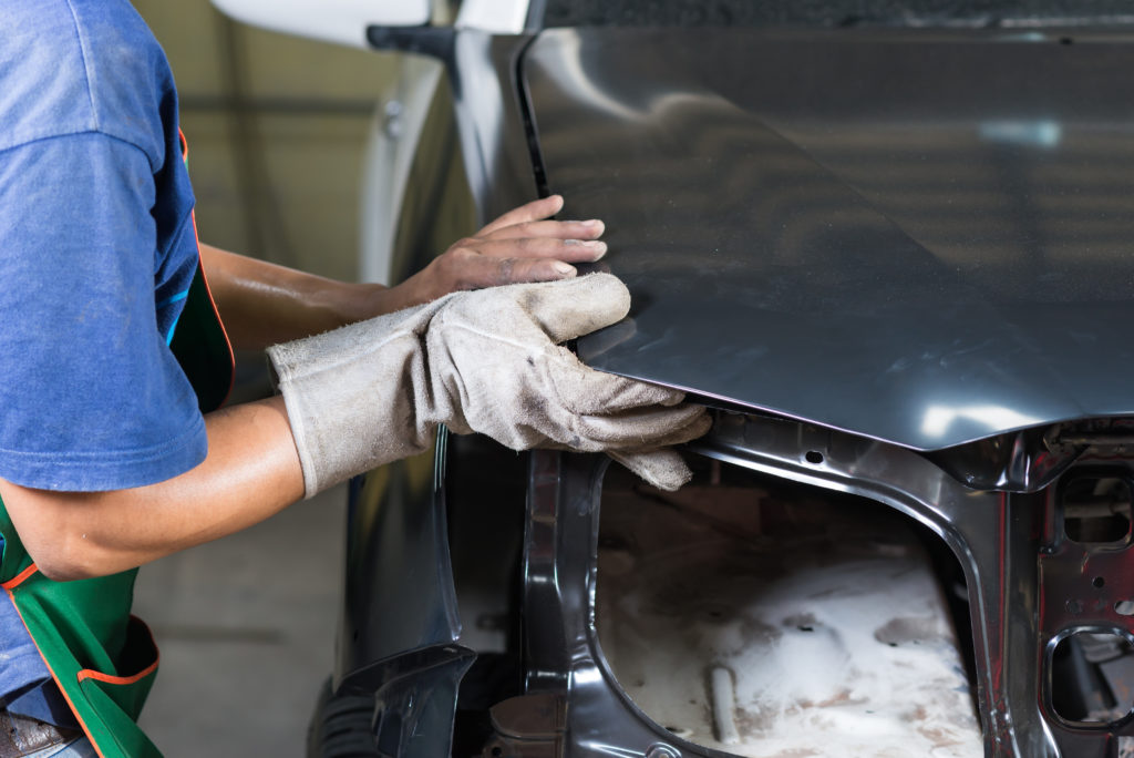 body shop replaces car body panel.jpg