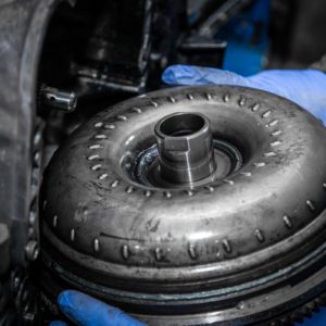 torque converter held by mechanic