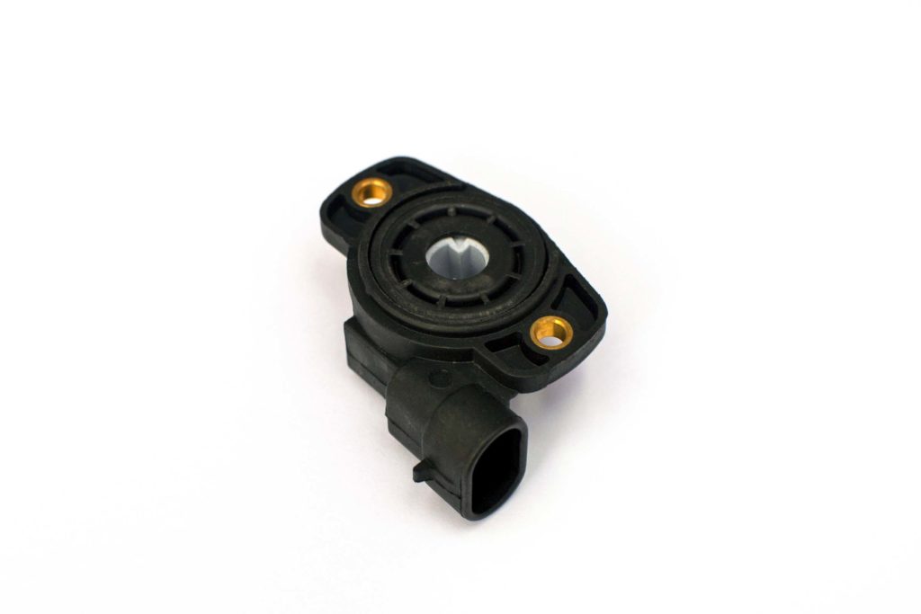 modern black throttle position sensor in white background