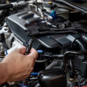 fuel injectors on top of car engine