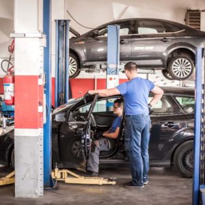 mechanics perform obd check on car