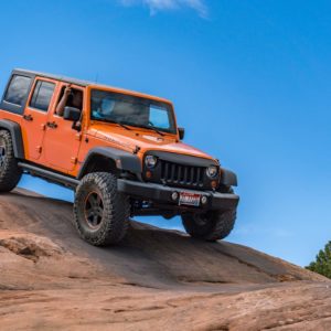 modified Jeep Wrangler on sandstone