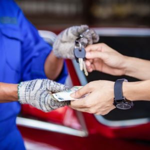 paying a car mechanic