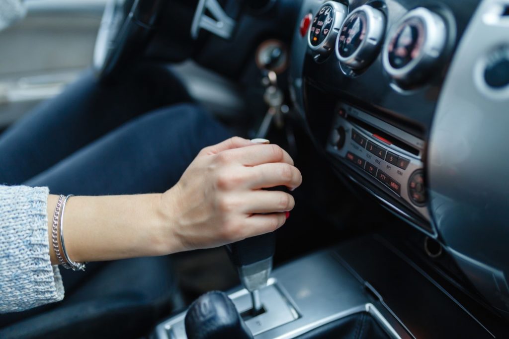 female driver shifting A/T gear