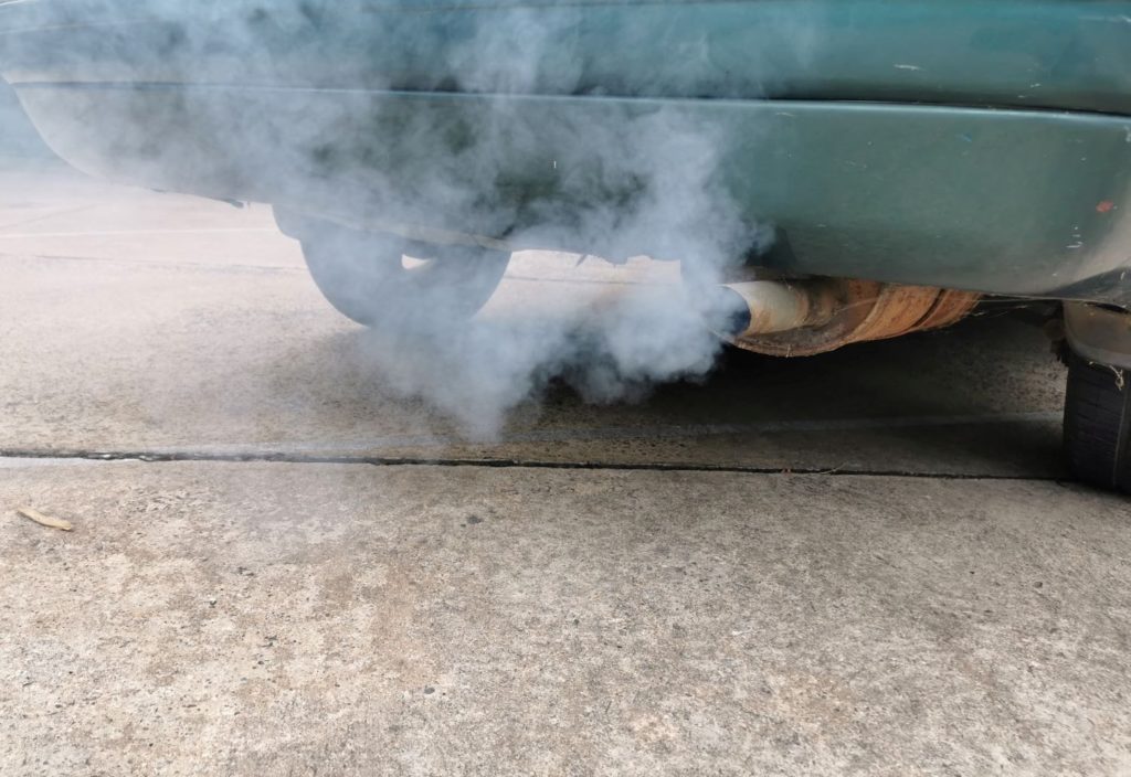 white smoke coming out of a car exhaust