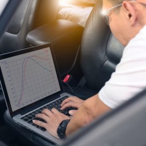 car mechanic using laptop