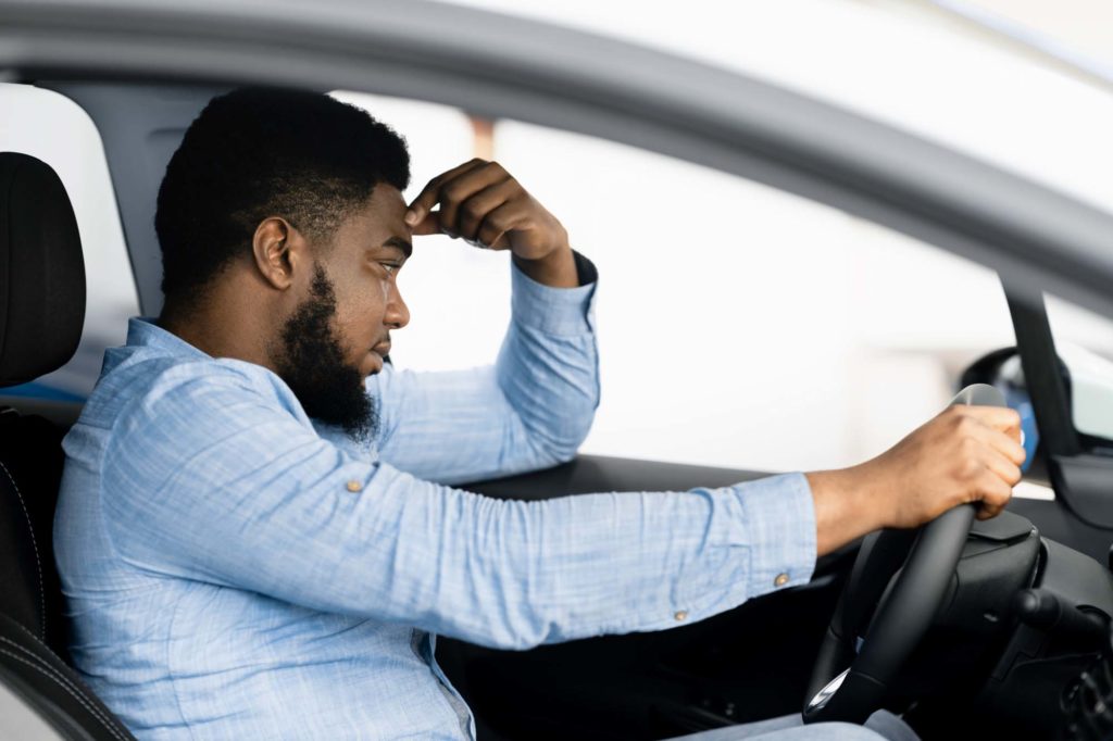 male driver trying to keep calm under stress