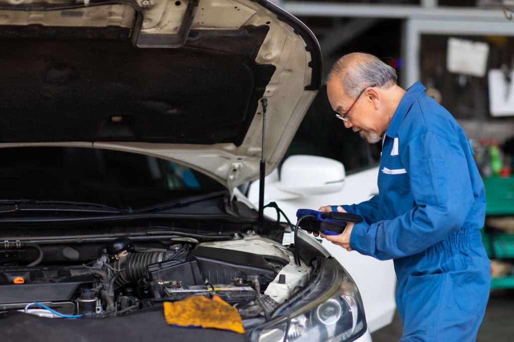 old mechanic doing car inspections after diagnosing p061a code