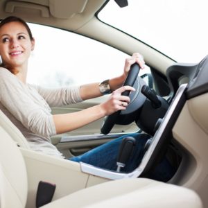 woman driving a new car