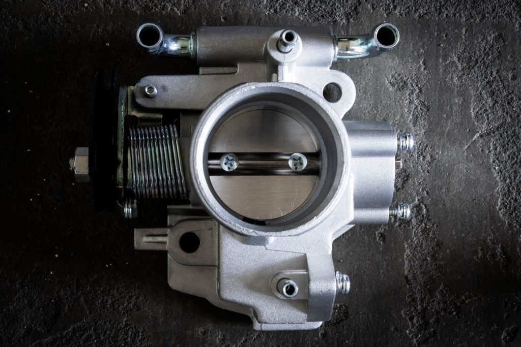 image of an automotive throttle body with its plate