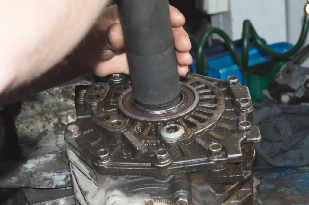 hand holding an automotive transfer case