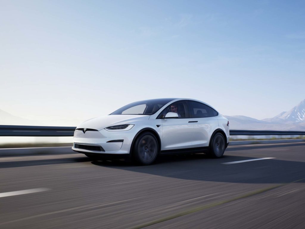 white tesla model x road travel