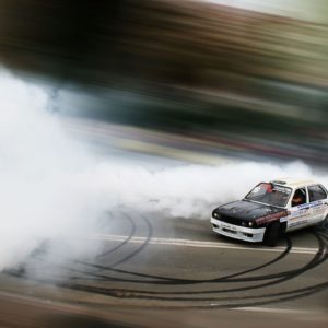 white race car doing donut