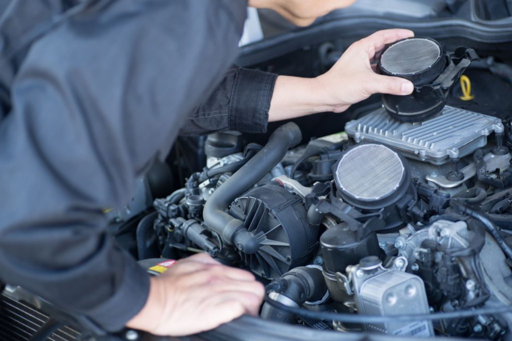 mechanic removing a maf sensor