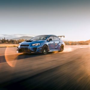 blue subaru wrx on the road