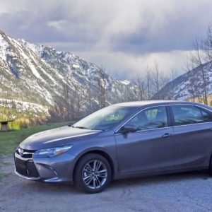 toyota camry with snowy mountains at the back