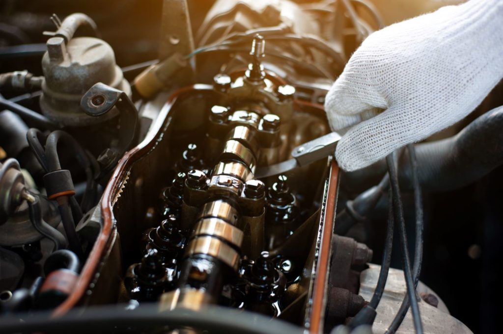 zoom in shot of a car engine and camshaft