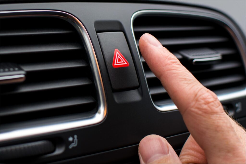 car hazard warning lights button red triangle activated