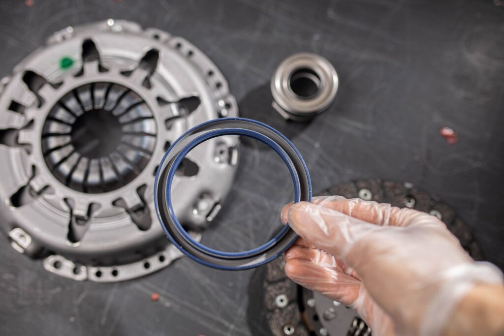 hand holding a crankshaft seal