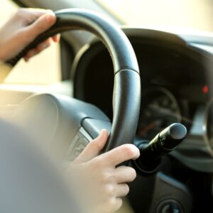 hands on a steering wheel