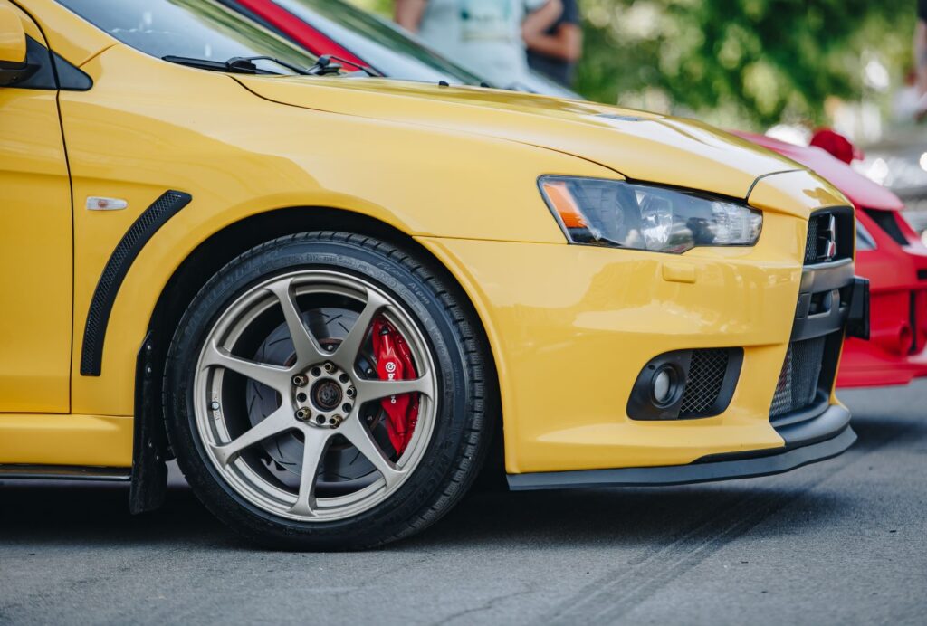 side shot of a yellow lowered car