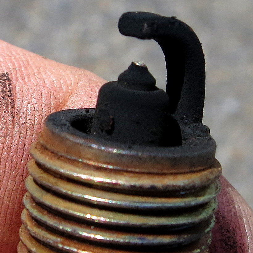 soot or carbon can deposit itself on the edge of the spark plug