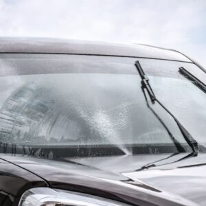 car with windshield wipers on