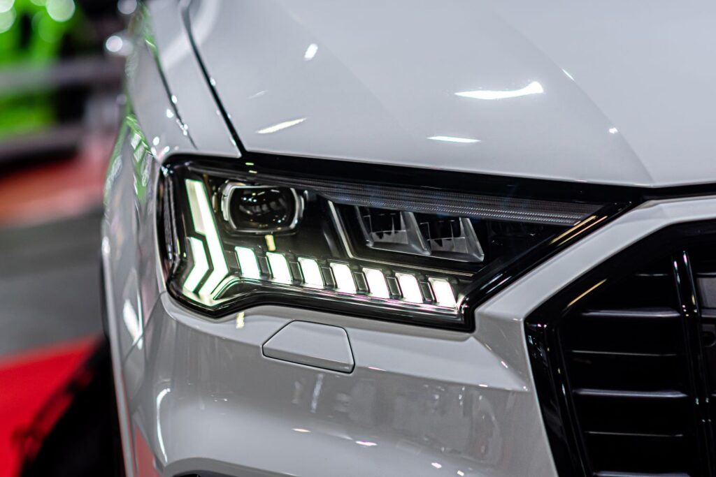 illuminated LED headlight of a white car