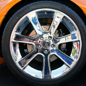 orange car with chrome wheel