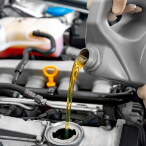 pouring car engine oil