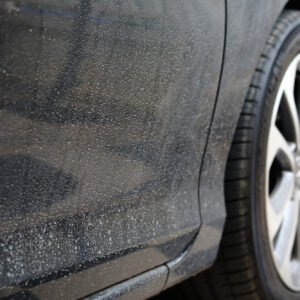 water spots formed on a black car