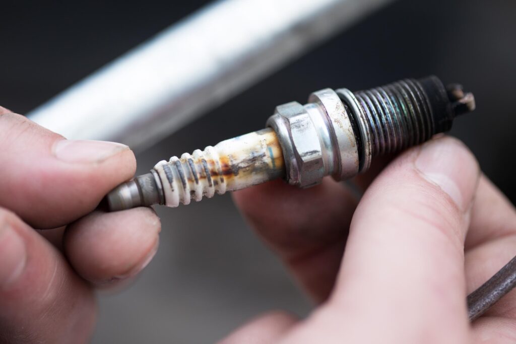 worn out spark plug removed from car