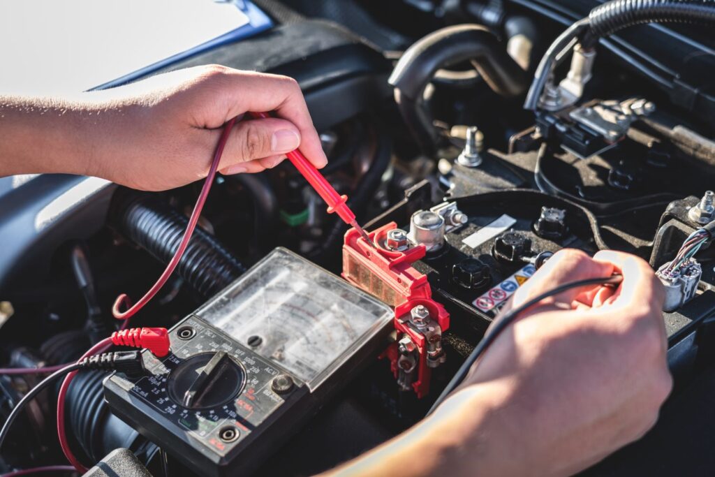 person checking battery voltage