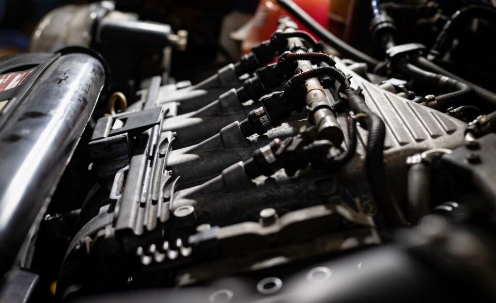 close up shot of a car engine and fuel system components