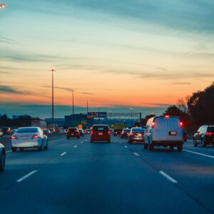 cars driving at dusk