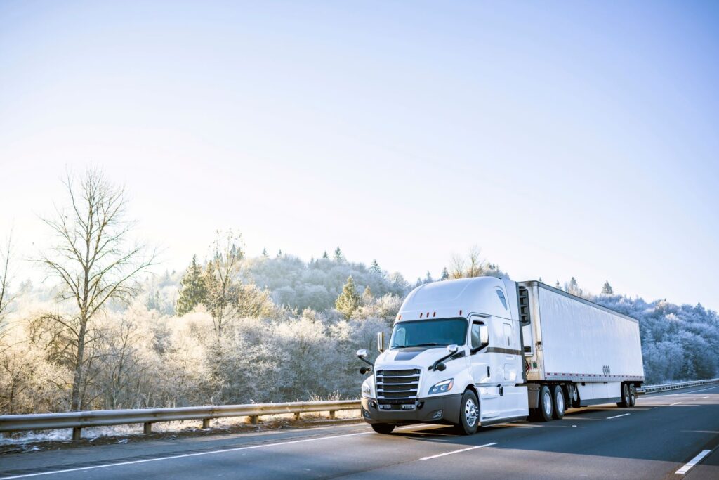 white large truck on the road