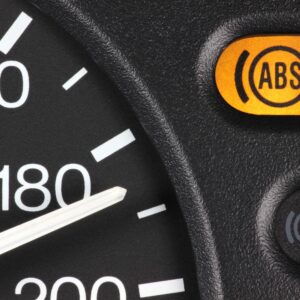 a portion of car speedometer with an abs light on