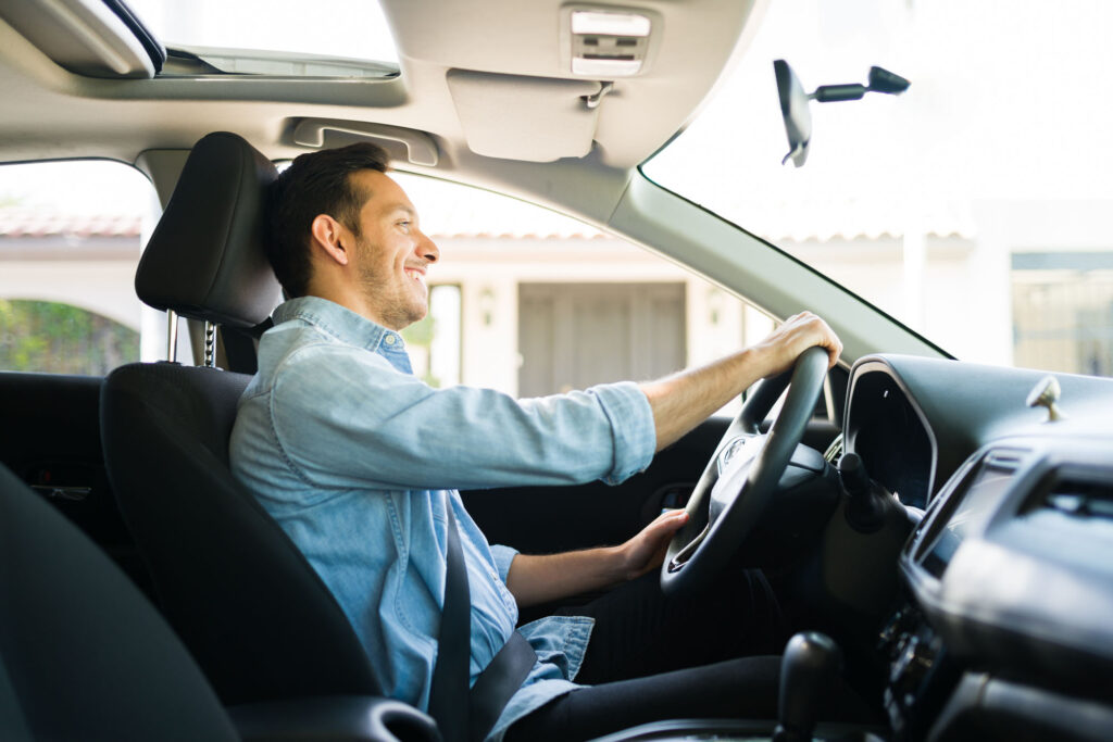 Hispanic,Man,Feeling,Happy,While,Working,As,A,Taxi,Driver