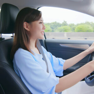 female driving on a freeway