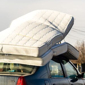 car with a mattress on its roof