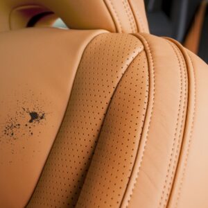 paint on a brown car leather seat