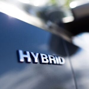 close up shot of a hybrid car logo