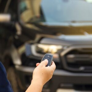 driver using a key fob to a truck