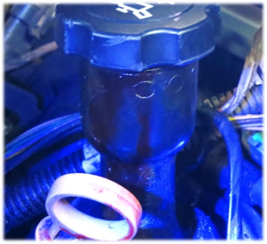 image of a uv light oil filler cap seal leak