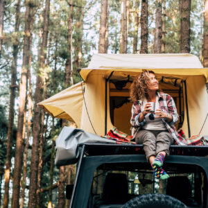 female car camper enjoying nature