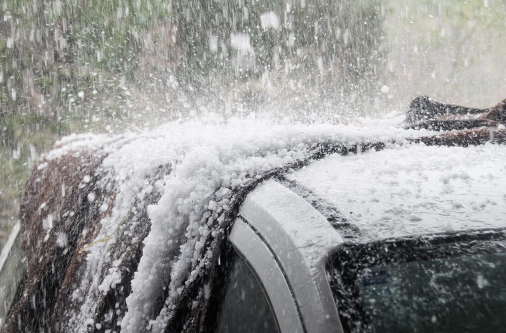 hailstones hitting car roof