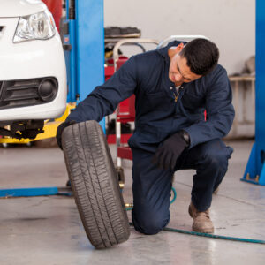 man looking for car tire expiration date